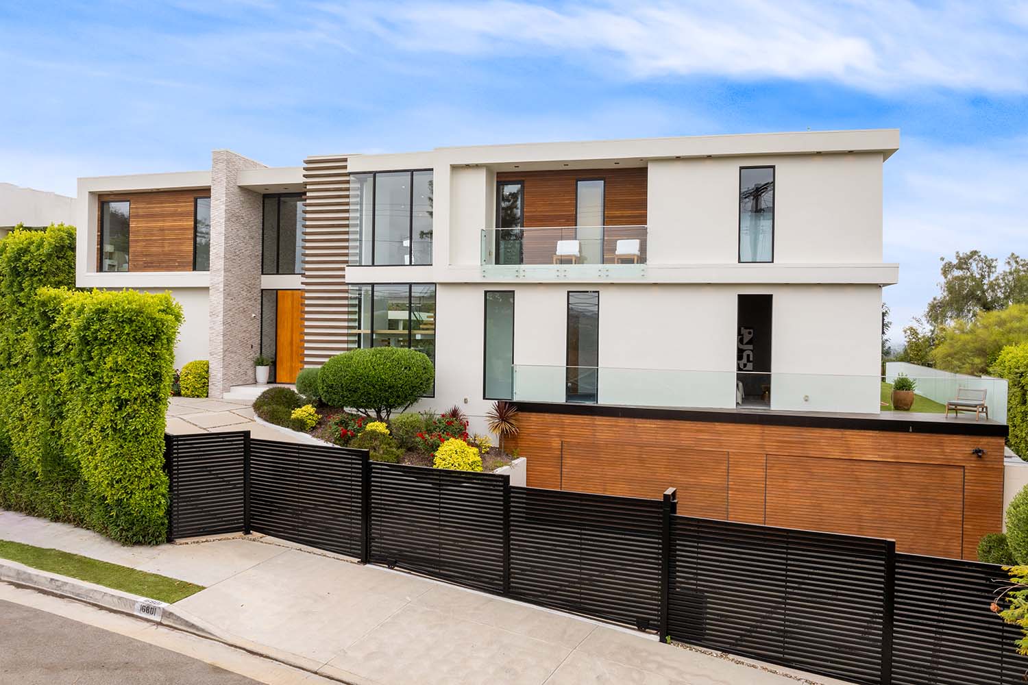 contemporary-house-on-a-corner-lot-with-lush-folia-JMLTCWM.jpg